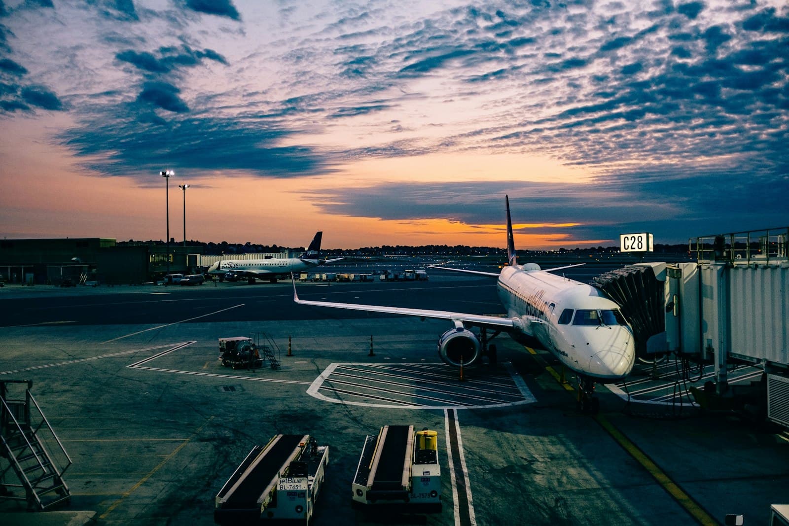 Aircraft at an international airport gate at dusk